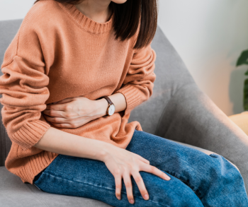 woman holding stomach