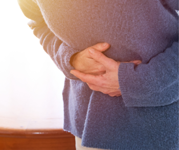 woman holding stomach