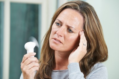 menopausal woman experiencing a hot flush