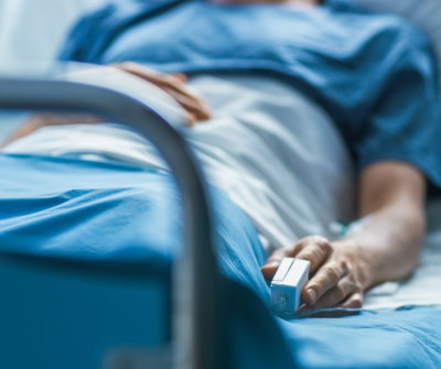 patient laying in hospital bed